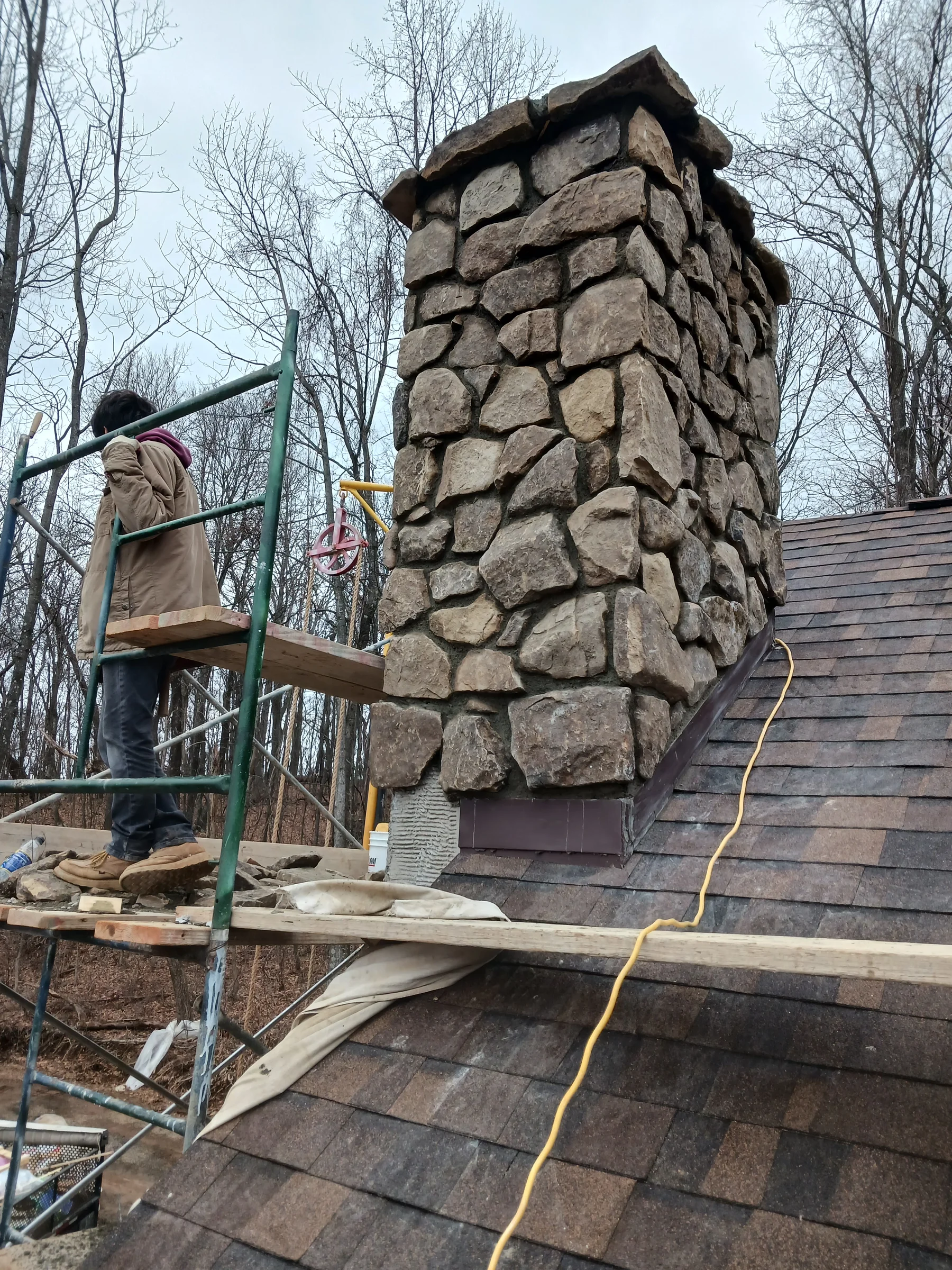 Stone chimney beside an outdoor staircase
