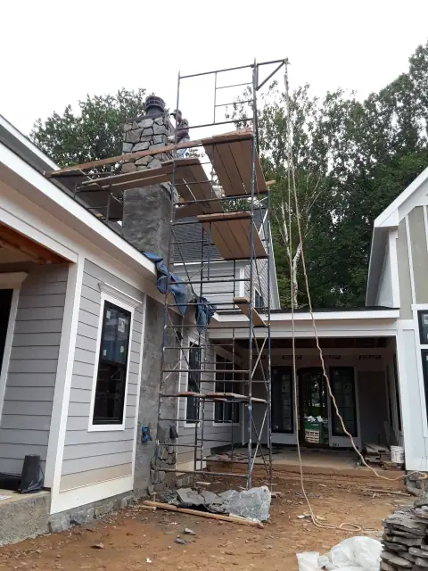 Chimney construction or repair in progress by F. Stone Designs