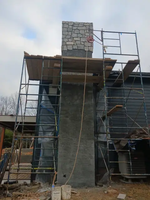 Chimney construction or repair in progress by F. Stone Designs