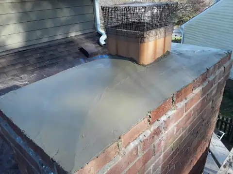 Brick chimney repair in progress