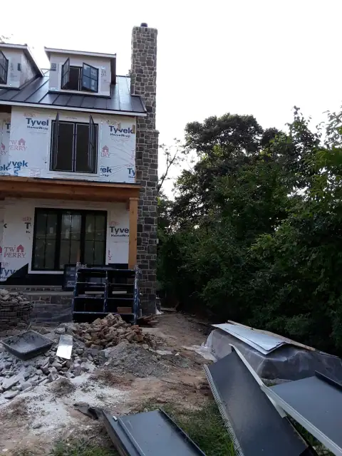 Chimney construction or repair in progress by F. Stone Designs