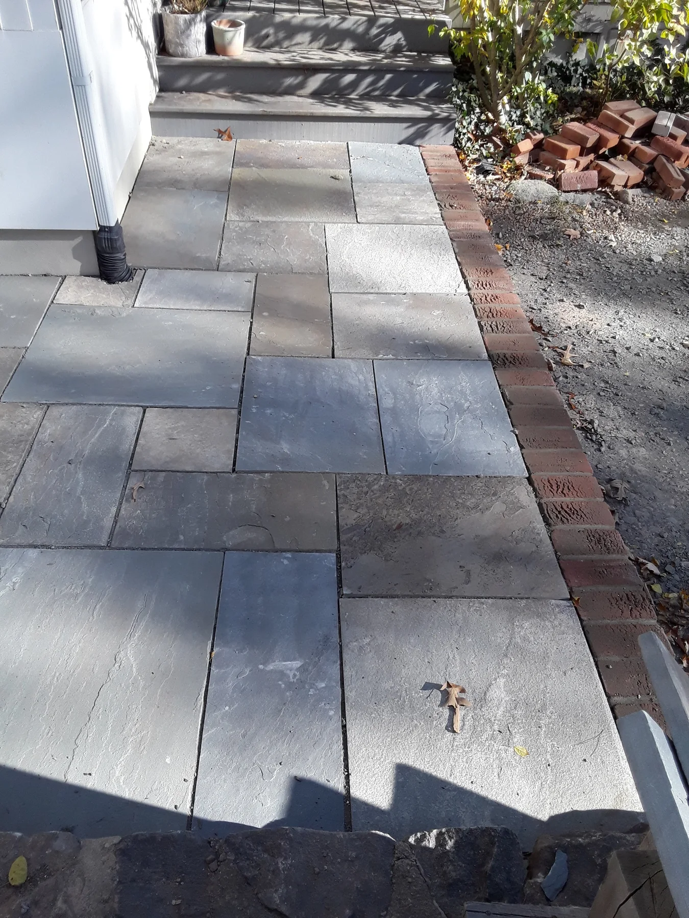 Rectangular pavers laid along a planted garden bed