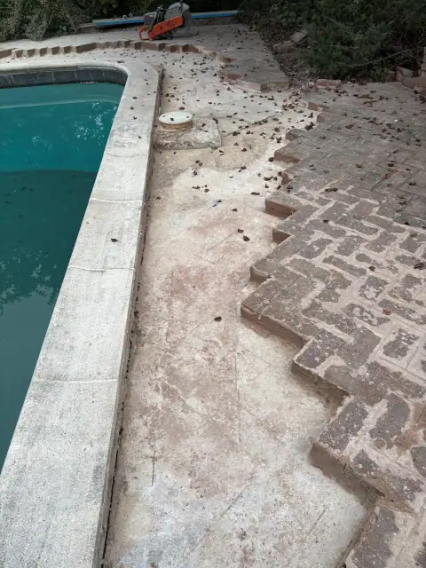 Poolside paver repair in progress