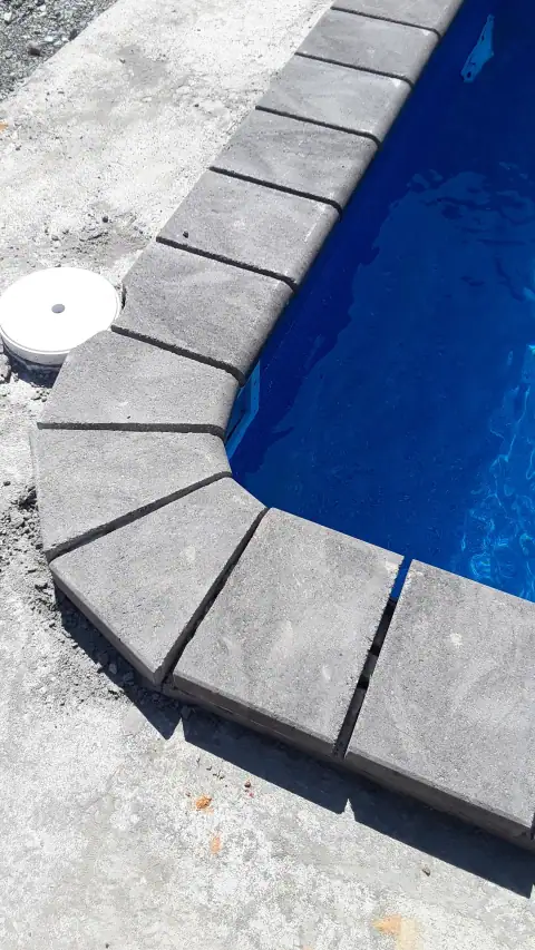 Pool coping installation detail with work materials