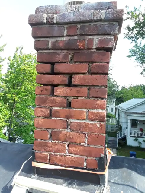 Chimney construction or repair in progress by F. Stone Designs