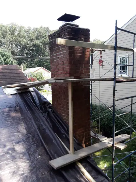 Chimney construction or repair in progress by F. Stone Designs