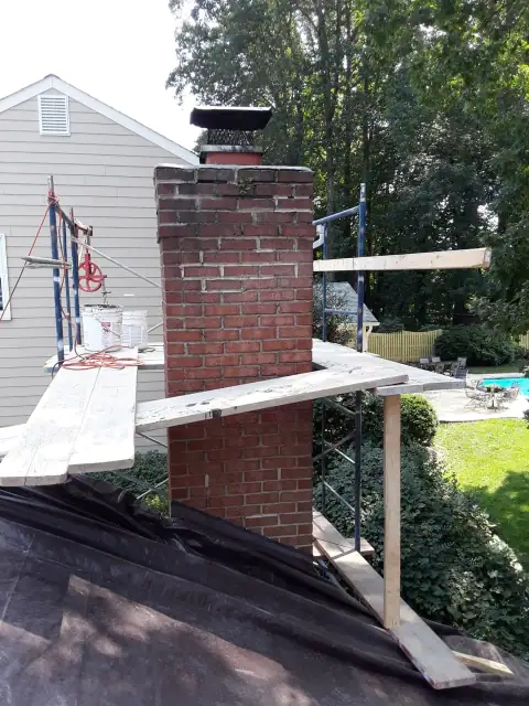 Chimney construction or repair in progress by F. Stone Designs