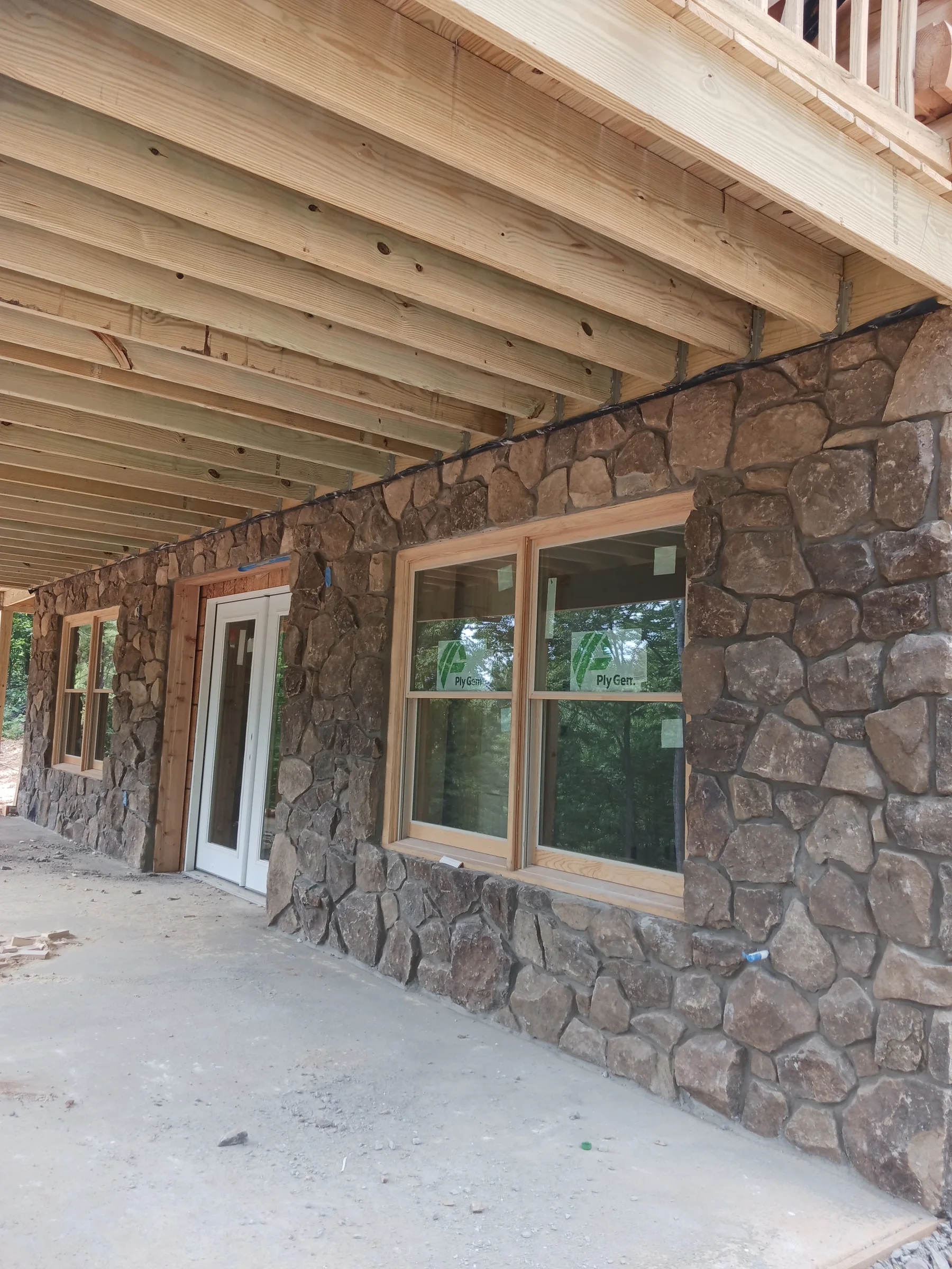 Stone-clad columns around a covered porch